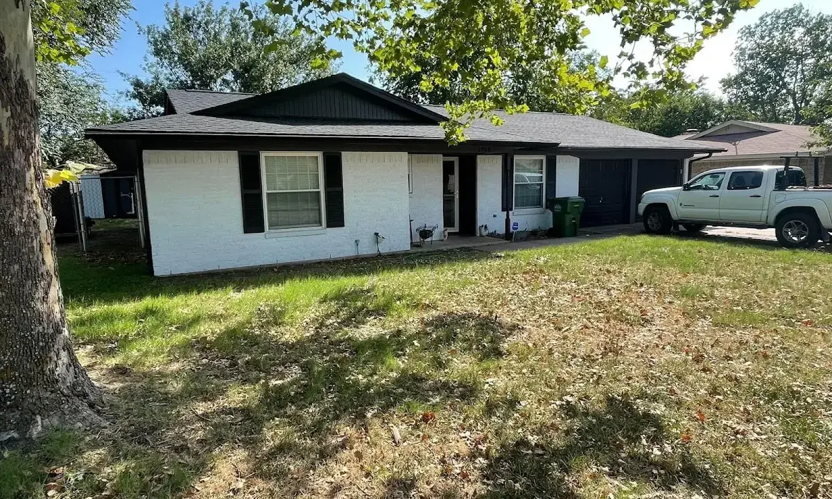 Professional roofing crew working on a residential roof in Del Aire
